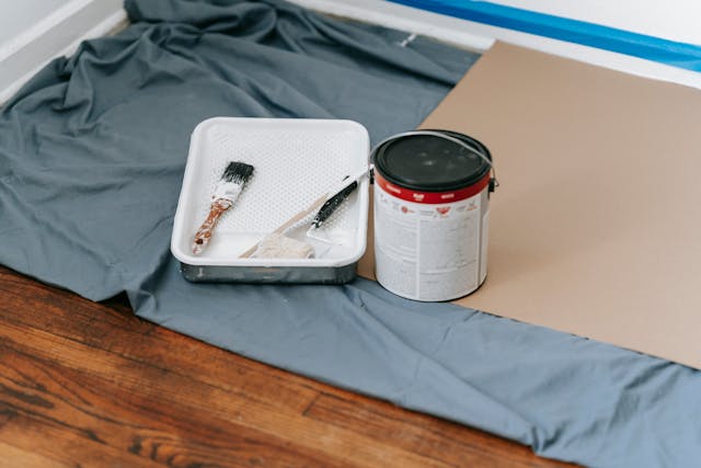 a paint can and paint supplies